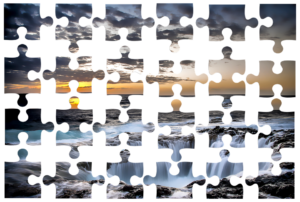 puzzle pieces disconnected but in the right places to show a sunset over the water