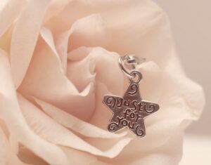 a rose with an ornament that says "just for you"